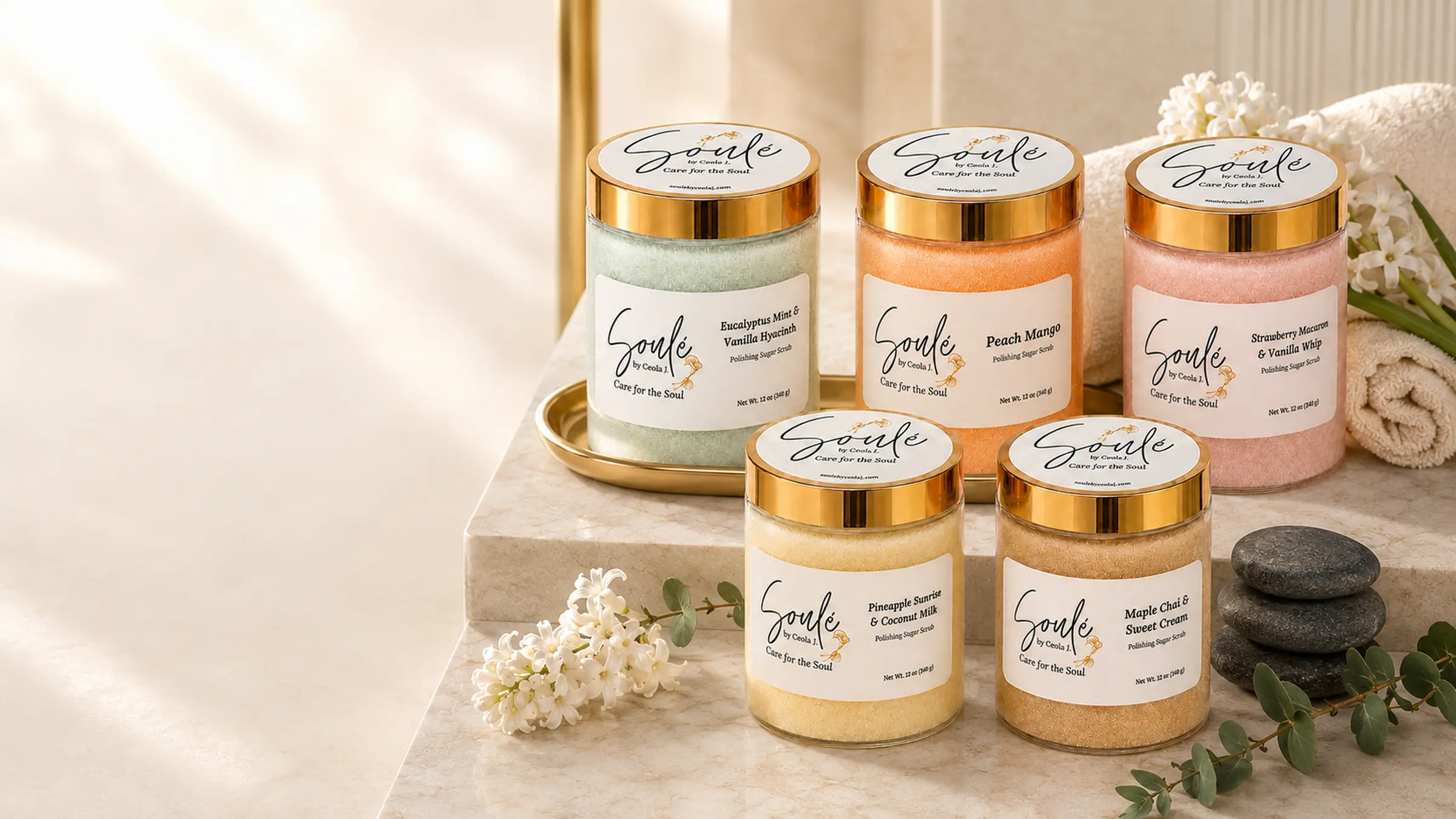 All five Soulé Polishing Sugar Scrub jars styled together — Eucalyptus Mint & Vanilla Hyacinth, Peach Mango, Strawberry Macaron & Vanilla Whip, Pineapple Sunrise & Coconut Milk, and Maple Chai & Sweet Cream