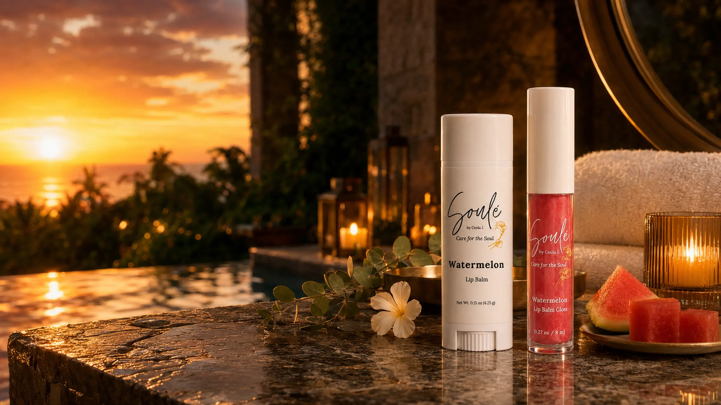 Soulé Watermelon Lip Balm and Watermelon Lip Balm Gloss styled poolside at sunset with fresh watermelon